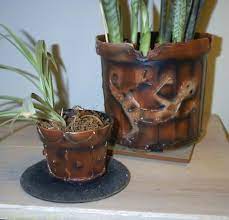 Plastic Pot Recycling Turn Your Basic Black Nursery Pots Into Something Attractive And Unique Plastic Plant Pots Plastic Nursery Pots Clay Pot Crafts