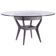 A presentable voguish dining table featuring a round flat base with small metal feet and a round top crafted of black tempered glass. Artistica Formosa 2075 870 56c 56 Round Glass Dining Table With Solid Wood Base Baer S Furniture Dining Tables