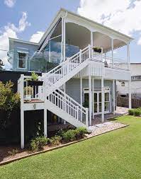 This Once Run Down Queenslander Has Been Lovingly Restored Queensland Homes Magazine Beach House Exterior Queenslander Front Stairs