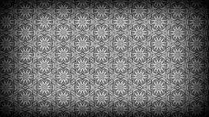 Arranged in a gorgeous geometric pattern, this bohemian chic wallpaper soothes, awakens and delights! Black And Grey Flower Background Pattern