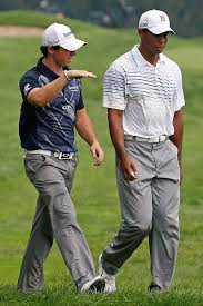Evans Mcilroy Standing In Tiger S Path Golf Inspiration Mens Golf Outfit Tiger Woods