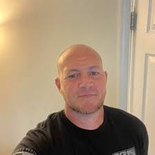 What is the name of the song with a music video featuring a janitor in a  gym, related to teen spirit?