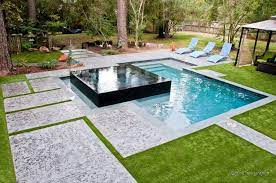 Ask this old house landscape designer jenn nawada installs a plunge pool for a homeowner with a small backyardsubscribe to this old house. An Awesome Combination Where The Spa Is The Highlight By Poolman Inc Houston Tx Swimming Pools Backyard Small Backyard Pools Backyard