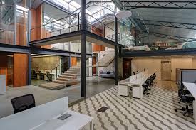 Offices In A Converted Warehouse Centre Around Suspended Concrete Stair Industrial Loft Design Warehouse Design Interior Design Degree