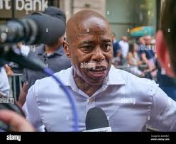 New York, New York, USA. 7th July, 2021. Democratic Candidate for NYC Mayor  Brooklyn Borough Presdident ERIC ADAMS greets crowd along sidelines in NYC  Hometown Heroes Parade. Ticker Tape was falling in
