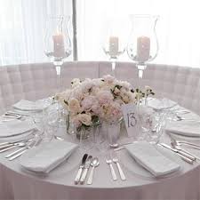 Pretty And Glam White Tables Winter Wedding Inspiration For More Inspiration Visi White Wedding Decorations Round Wedding Tables Flower Centerpieces Wedding