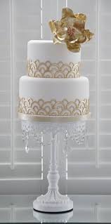 It is about trying to recapture our fleeting joys, about the fugitive nature of delight. Gatsby Inspired Cake Art Deco Wedding Cake Golden Wedding Cake Art Deco Cake