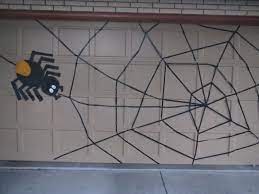 Electrical Tape To Make A Garage Door Halloween Spider Web Halloween Haunted House Decorations Halloween Inspiration Halloween Decorations