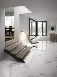 Stone entryway floors are a durable and strike resistant choice. White Marble Stone Marble Flooring Design Living Room Tiles Tile Floor Living Room