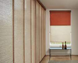 The Perfect Coordination Of Hunter Douglas Roller Shades And Skyline Gliding Window Panels Offe Hunter Douglas Roller Shades Living Room Shades Hunter Douglas