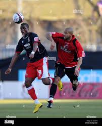 Bournemouth's Ryan Garry and Cheltenham Town's Justin Richards during the  Coca-Cola League Two match at the Fitness First Stadium, Bournemouth Stock  Photo