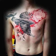 A crow is illustrated perched atop a branch while a black tree sits in the background of this tattoo. 115 Attractive Crow Tattoos With Meanings And Ideas Body Art Guru