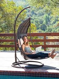 Brown Wicker Hanging Chair With Cushions In 2020 Swinging Chair Hanging Swing Chair Patio Swing Chair