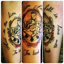 This one isn't bad so much for what it looks as for where it is. Tattoo Uploaded By Matthew My Twilight Cullen Crest Tattoo With A Quote From The Book And Film And So The Lion Fell In Love With The Lamb 168890 Tattoodo