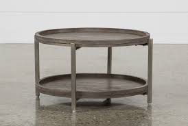 True To Its Name This Round Coffee Table Is Just Swell Sleek Nickel Finished Iron Legs Stand Sturd Round Coffee Table Coffee Table Living Spaces Coffee Table
