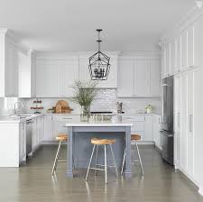 White U Shaped Kitchen With Gray Island