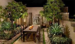 The flowering shrubs and plants provide a colorful contrast to the gray exterior of the house. 15 Ideas For Asian Patio Designs Home Design Lover