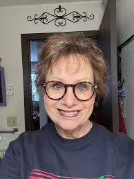 New Haircut with Red Highlights and Eyeglasses