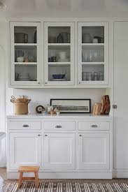 Wire racks, like those shown in this martha stewart kitchen, create tiers allowing kitchen users take advantage of vertical space—without making it difficult to access stacked items. Organize Your Kitchen Cabinets In Nine Easy Steps Martha Stewart
