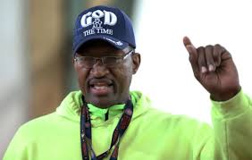 The Rev. Wayne Dunning rolls up his sleeve to encourage vaccinations in  Black community