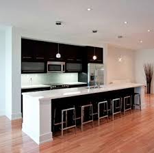 To give warmth, there are light brown floors, which material matches the doors on the cabinet. Guncel Haberler Dekorationn One Wall Kitchen Kitchen Layout Modern Kitchen Island