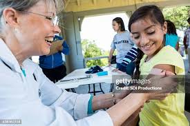 897 Child Getting Flu Shot Stock Photos, High-Res Pictures, and Images