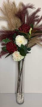 This vase is crafted of ceramic and finished with black/gold glaze. Tall Floral Vase 1 Moments Made Easy
