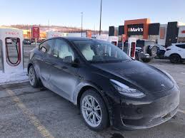The picture gallery contains over 20 images, sharing shots never seen before of the model y's fully open trunk, storage under the trunk, front trunk looking at a clear picture of the rear trunk/hatch open, it's clear there's lots of storage space in the model y: Second Tesla Model Y With White Interior Spotted In Canada In Northern Ontario Drive Tesla Canada