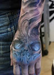 60 Awesome Skull Tattoo Designs Cuded Hand Tattoos For Guys Skull Hand Tattoo Hand Tattoos