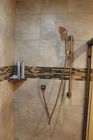tiled shower area with accent strips
