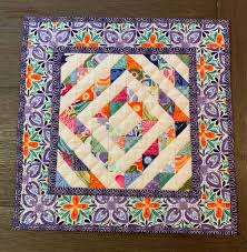 Scrappy Quilted Table Topper Square Spring Table Runner Quilted Purple Green Orange White Flora In 2020 Spring Table Runner Floral Table Runner Quilted Table Runners