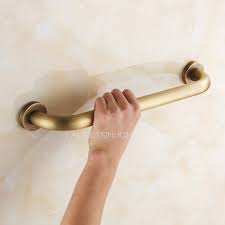 The addition of these devices in the tub, by the toilet, and in transitional locations will enhance safety and assist individuals of all ages and abilities. Designer Antique Brass Safety Bathroom Shower Grab Bar