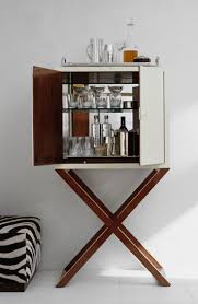 A Chic Bar Cabinet Reveals The Makings Of Cocktail Hour By Ralph Lauren Home Home Bar Decor Bar Cabinet Design Bar Cabinet