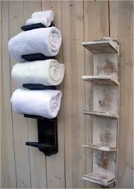 Simply put these items in glass canisters or wicker storage bins for easy organization and then place them on the shelf of your new bathroom linen cabinet. Outstanding Bathroom Storage Cabinet With Towel Rack Exclusive On Homesable Home Decor Bathroom Towel Storage Rustic Bathroom Shelves Small Bathroom Storage