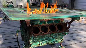 Instead of running a gas line, this fire pit will run off a propane tank. This Fire Breathing Engine Table With Working Gas Pedal Is So Metal