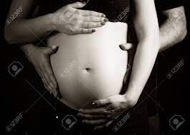 The first one is a woman who is pregnant with quadruplets and even the hostess from good. Father And Mother Holding Hands On A Pregnant Belly Black And Stock Photo Picture And Royalty Free Image Image 28876414
