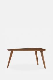 A glass coffee table makes for an elegant, subtle addition to the room, while a coffee table with storage is perfect for creating space for a striking centerpiece. 366 Triangle Coffee Table Designed By 366 Concept
