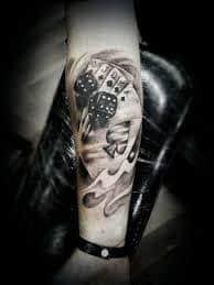 These tattoos can be drawn with playing cards surrounded by flames, aces and eights representing the dead man's hand, or a heart surrounded by dice and the words not to gamble with love. What Does Card Tattoo Mean Represent Symbolism
