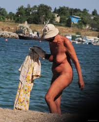 Amazing granny tanning on the beach fully naked show her awesome streched  cunt