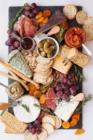 Learn how to make a gorgeous appetizer platter (charcuterie board) that'll impress everyone and disappear quickly at your next party. How To Make An Awesome Cheese Board In Minutes Wholefully