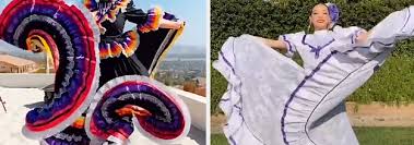 A lady at local vela wears a traditional gala tehuana dress. These Traditional Mexican Dresses And Folkloric Dances Are Incredibly Beautiful