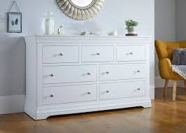 Consider these uses for a bureau in the living room or family room: Toulouse White Painted Grande Extra Large 3 Over 4 Chest Of Drawers Free Delivery Top Furniture