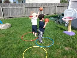 Take turns trying to land the beanbag in each other's hoop while the other player tries to block the throw. Hula Hoop Games Everyday Miracles Family Child Care Home