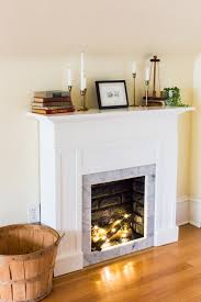 An appealing diy stone fireplace could be yours on the cheap—no masonry skills required—using an ultralight faux stone wall covering. Diy Faux Fireplace Mantel With Tile And Faux Brick