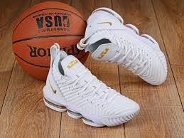 Constructed with a flyknit upper while a small nike swoosh logo on the heel which also features a debossed lion crest logo. Lebron James Basketball Shoes White Gold Shoes Girls Basketball Shoes Lebron James Basketball White And Gold Shoes