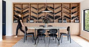 Add extra storage and contemporary style to your entryway, living room, or dining room with this accent cabinet. A Custom Designed Wine Storage Wall Is A Central Feature Inside This Remodeled Home