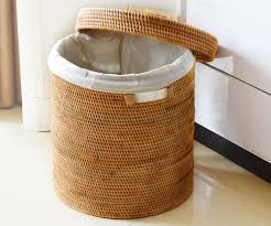 The organic texture and rich color of this basket is sure blend with any style décor while making a great storage solution. Large Hand Woven Clothes Basket With Cover Large Woven Basket Vietnam Round Basket Home Decor Storage Baskets Large Woven Basket Storage Baskets With Lids