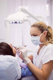 Subscribe to our free newsletters to receive latest health news and alerts to your email inbox. Dentist Examining Female Patient In Clinic Decay Lifestyle Stock Photo 225280512