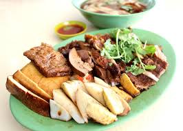 Serve the braised duck with yam rice, chilli sauce and braised eggs. Hawker Duck Rice Miss Tam Chiak