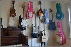 Good closet storage is essential for corraling clutter. 28 Guitar And Ukulele Instrument Display Ideas Guitar Wall Guitar Room Guitar Display